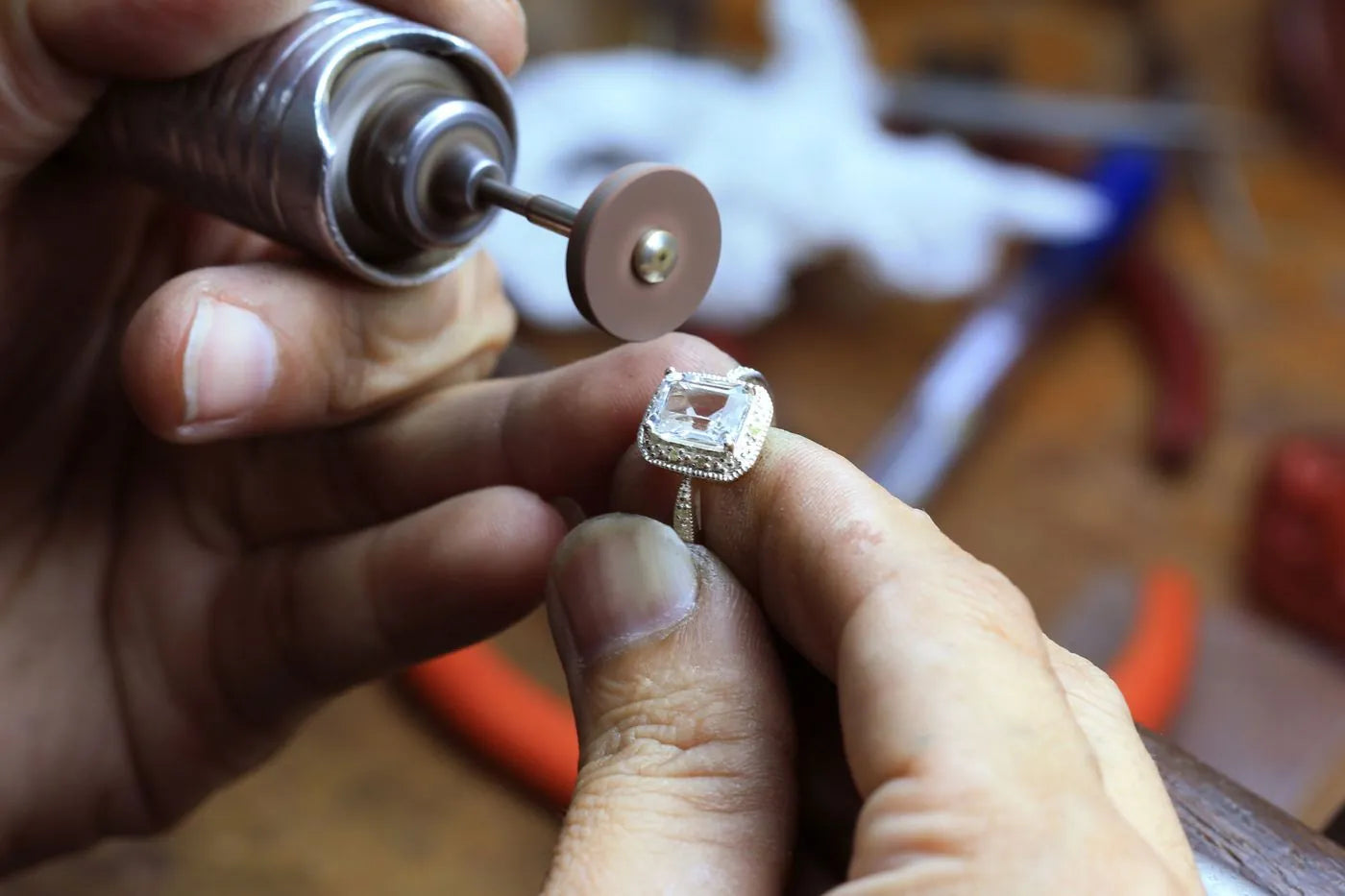 Jeweler setting a stone under magnification at the workbench