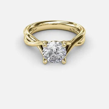 Round brilliant solitaire engagement ring with a twisted yellow gold shank
