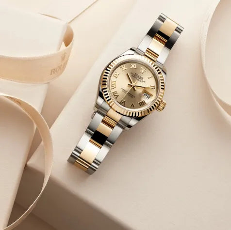 Luxury two-tone Rolex watch with gold dial displayed by LeeBrant Jewelry & Watch Co.
