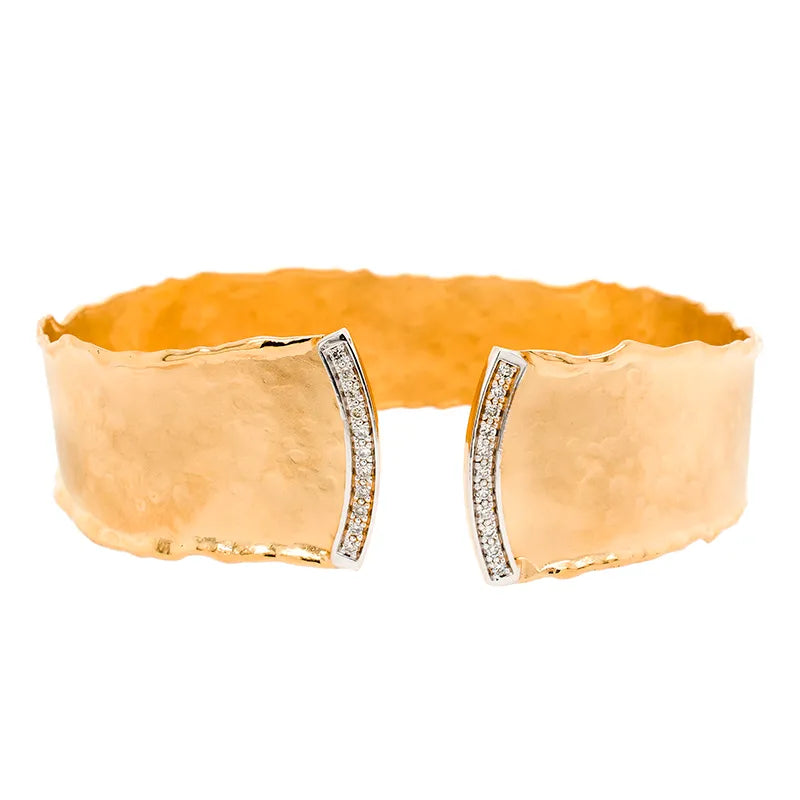 Hammered gold cuff bracelet with diamond set edges