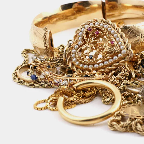 Assortment of gold jewelry and loose diamonds