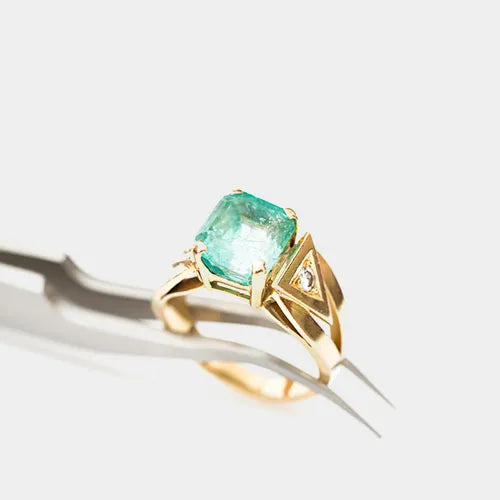 Jeweler repairing a ring at the bench